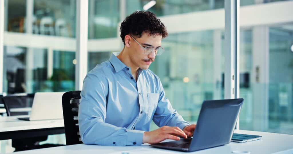 Remote employee accessing cloud document management from a home office laptop