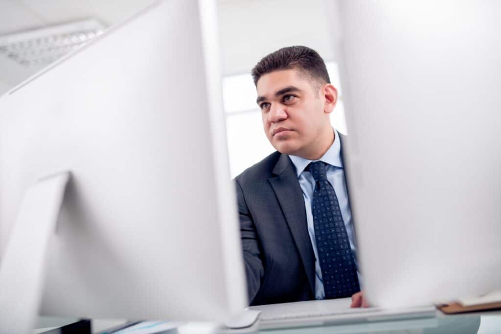 finance manager calculating document management ROI before purchasing a new system