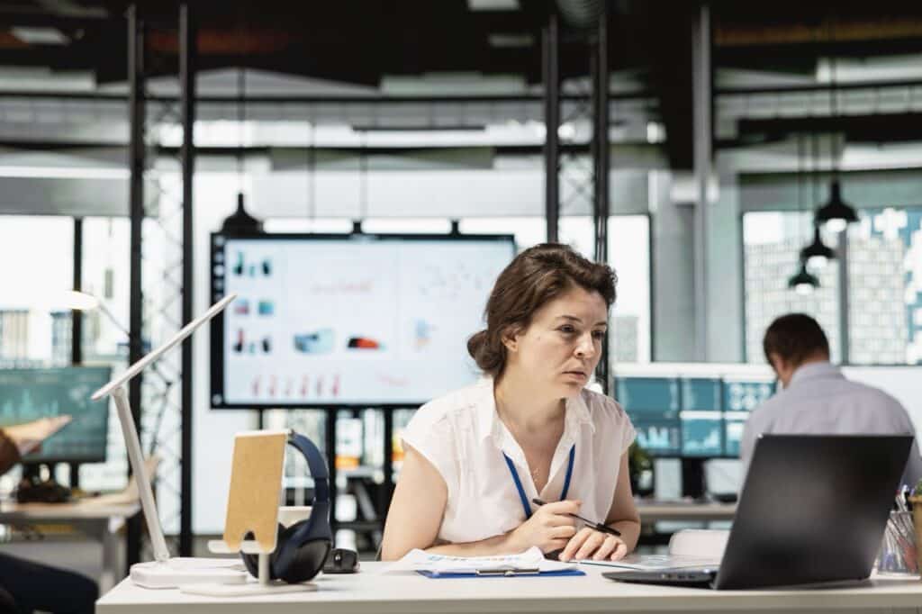 Operations team reviewing extracted invoice data flowing automatically into an ERP accounts payable record