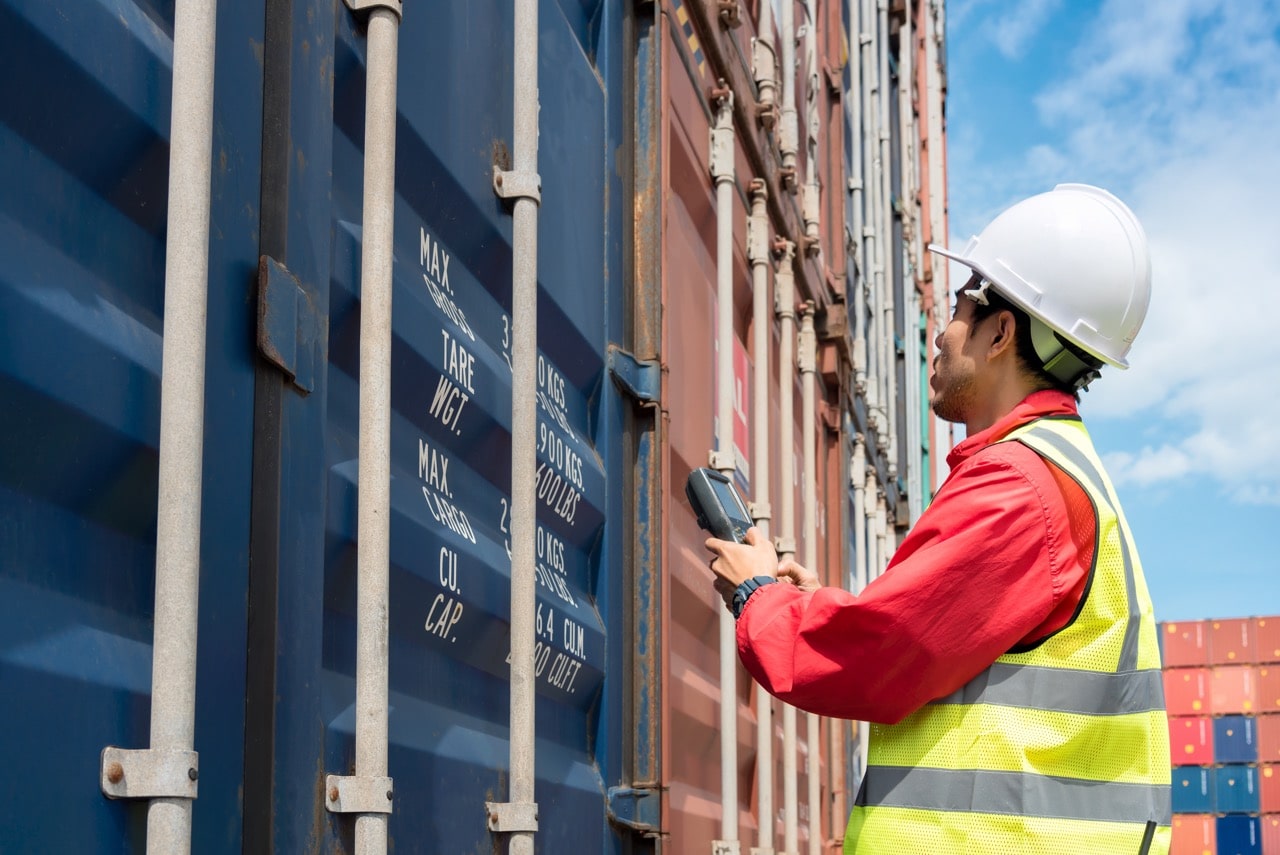 Fleet safety manager reviewing tanker inspection and hazmat compliance records