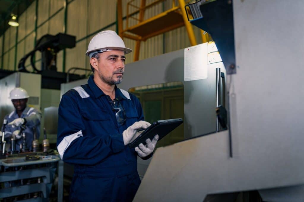 Quality engineer reviewing a nonconformance report and disposition record