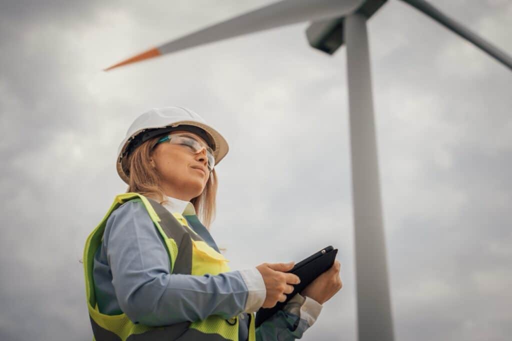 Field service technician submitting a utility work order digitally from a mobile device