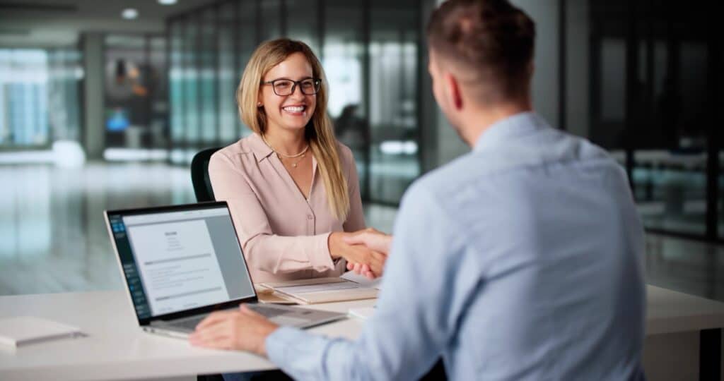 HR professional reviewing an automated employee onboarding document checklist on a screen