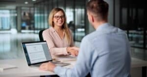 HR professional reviewing an automated employee onboarding document checklist on a screen