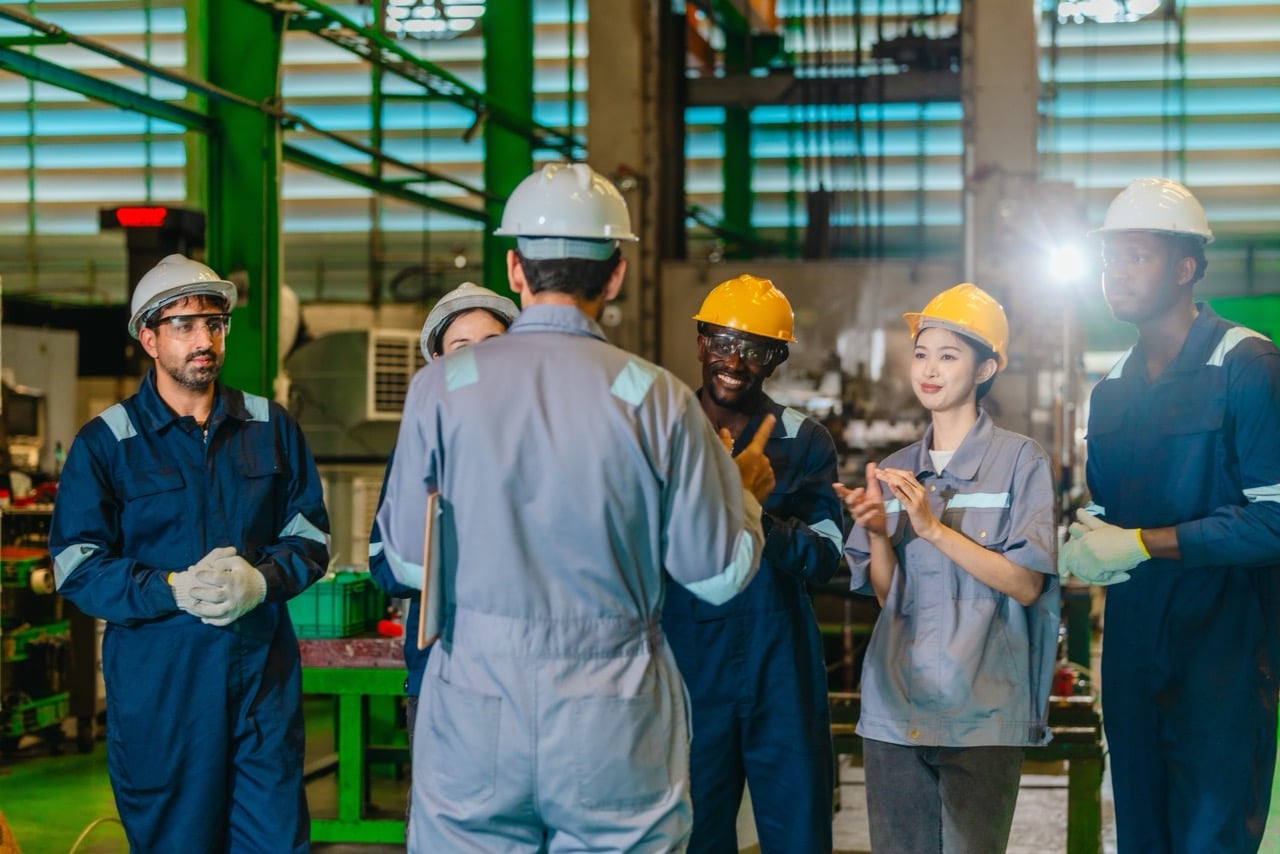 Machinist accessing digital work instructions on a shop floor tablet instead of paper