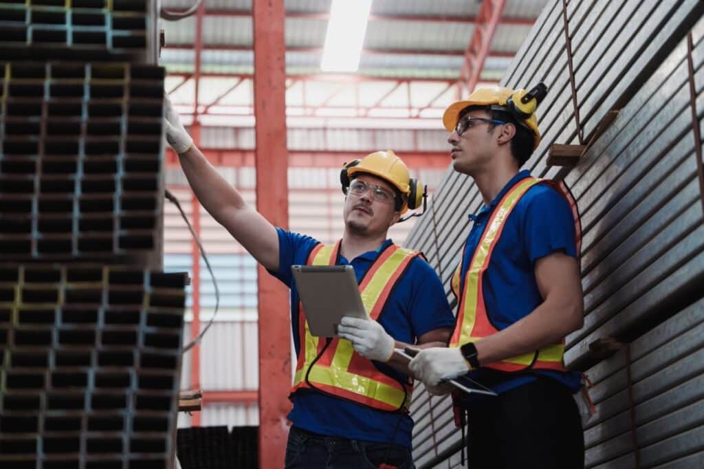 Manufacturing quality manager reviewing supplier qualification documents