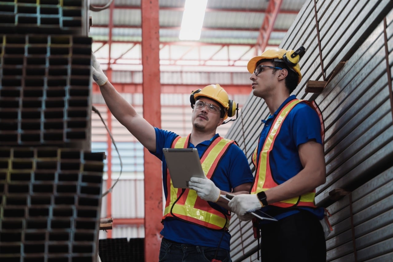 Manufacturing quality manager reviewing supplier qualification documents